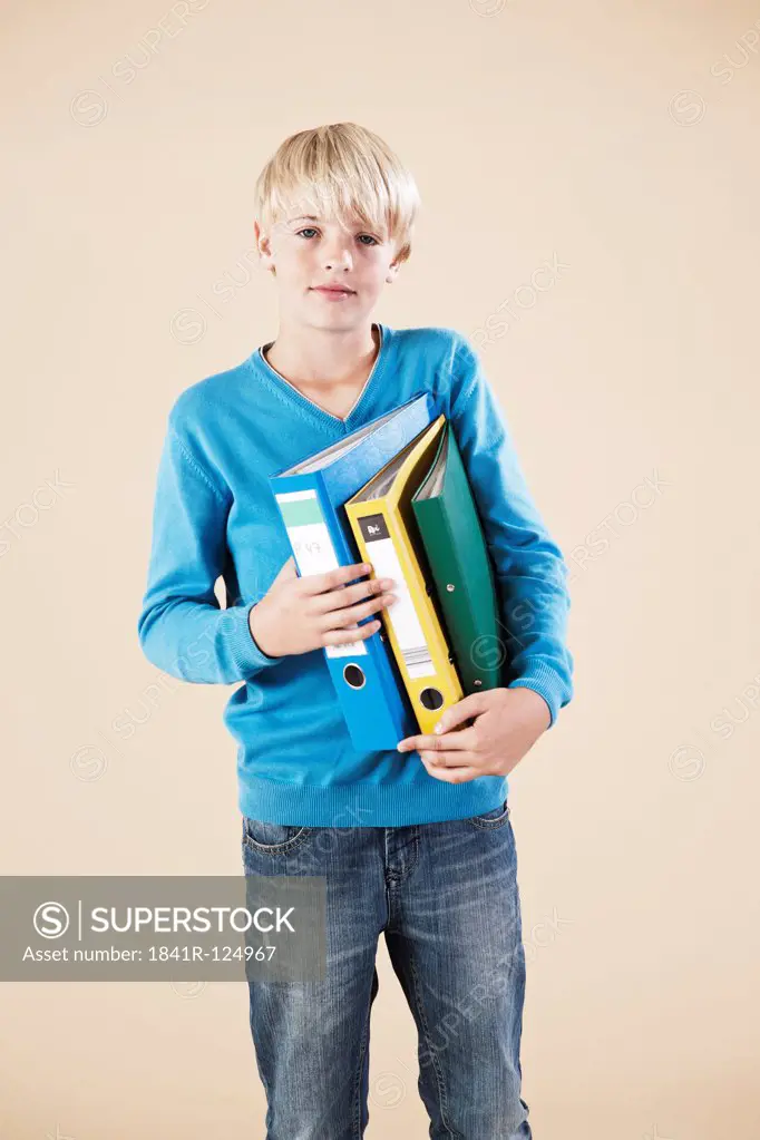 Blond boy with folders