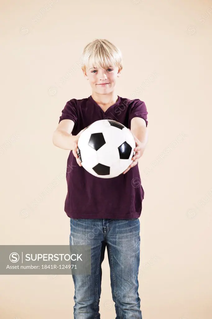Blond boy with a football