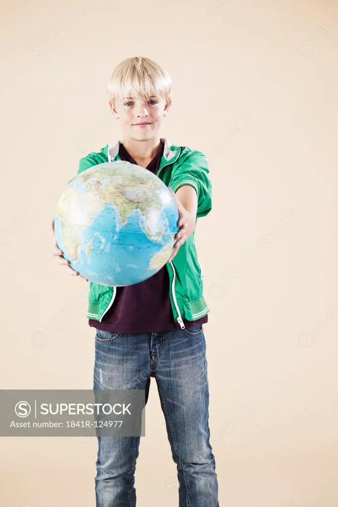 Blond boy with globe