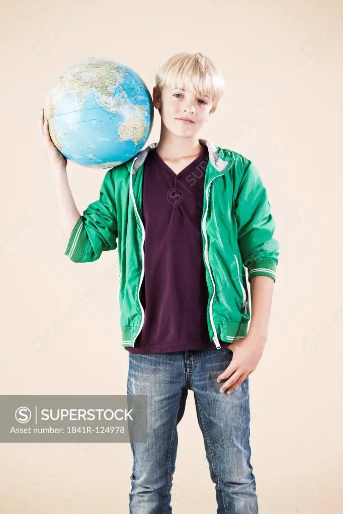 Blond boy with globe