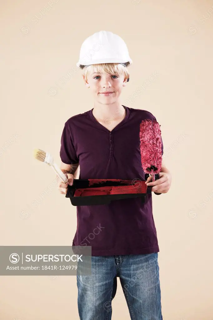 Boy with hard helm and brush