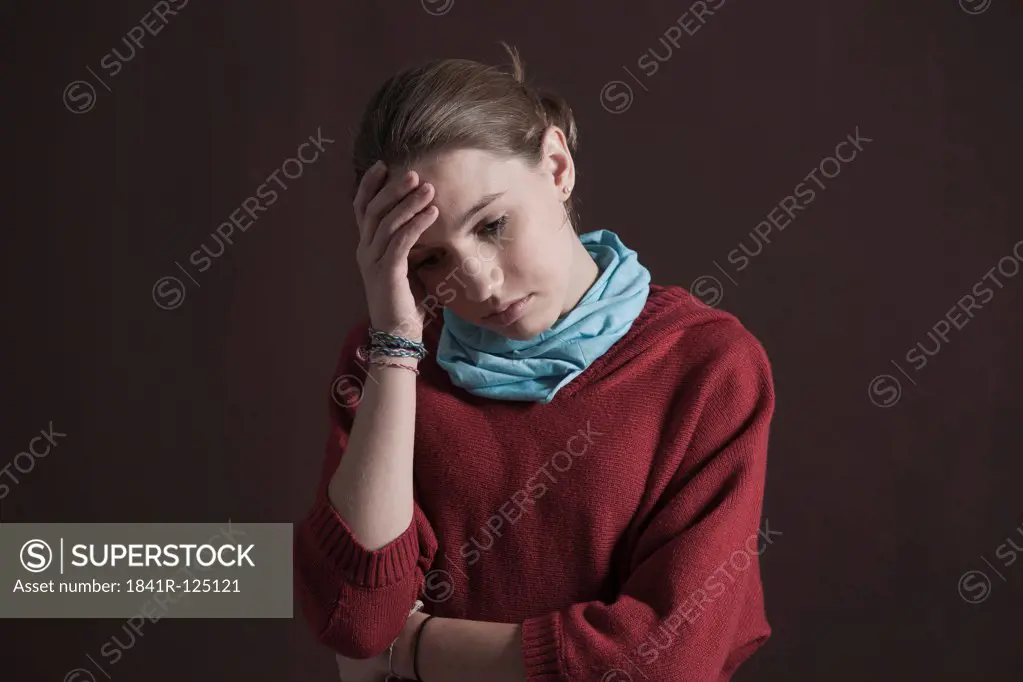 Teenage girl looking pensive