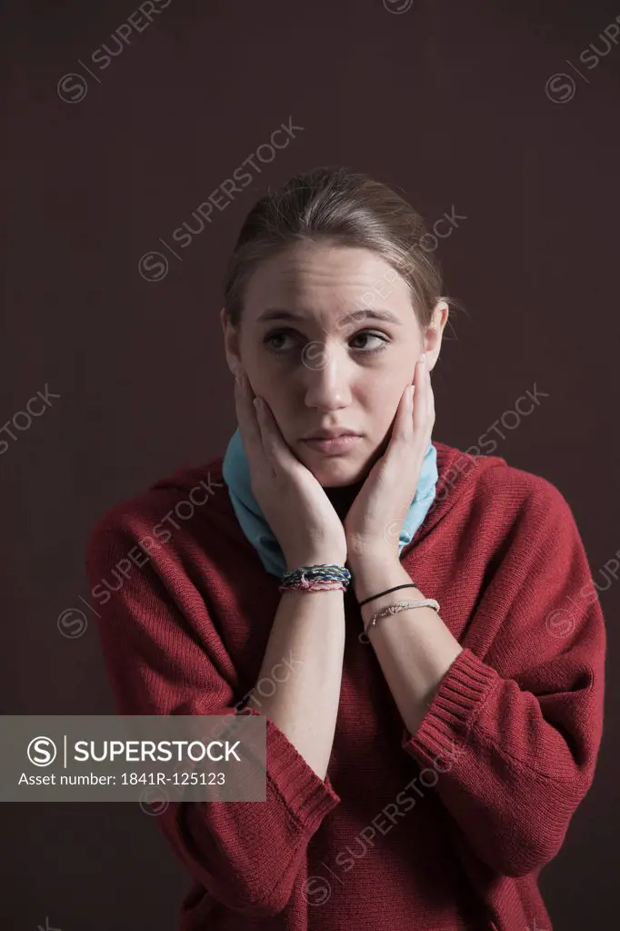 Teenage girl looking pensive