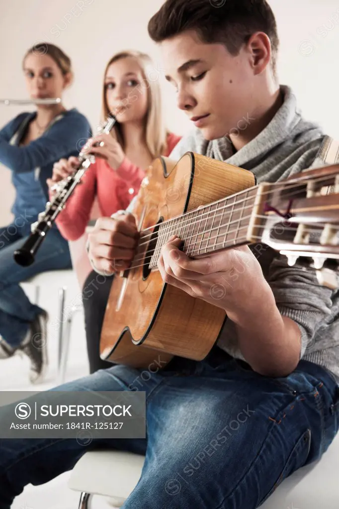 Teenager playing music