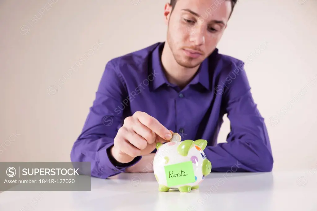 Young man saving money for pension