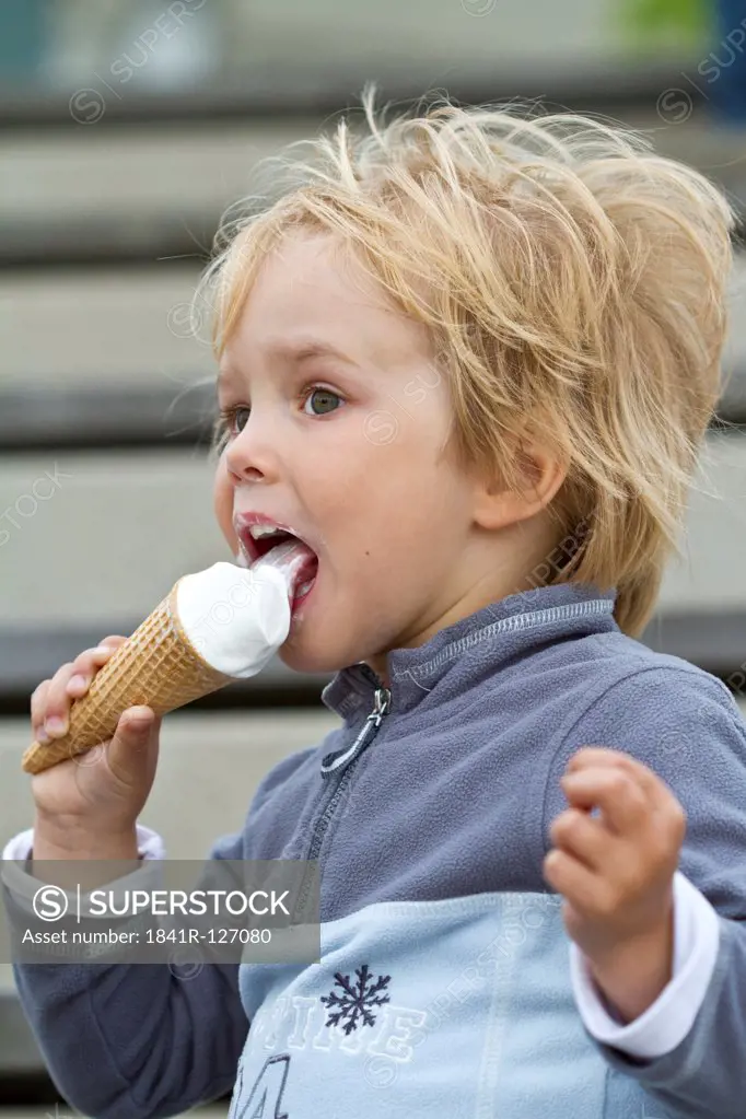 Toddler eating ice cream cone