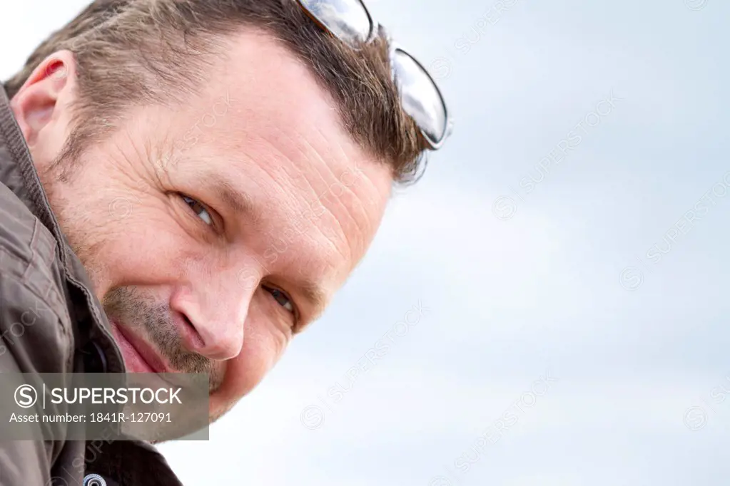 Smiling man outdoors, portrait