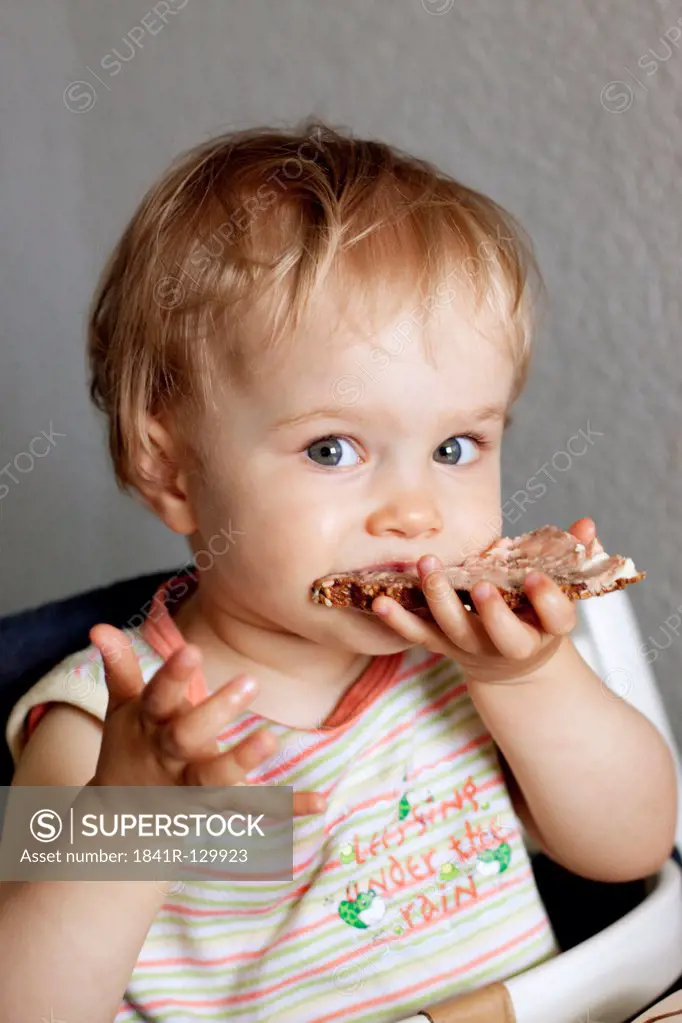 Toddler eating, portrait
