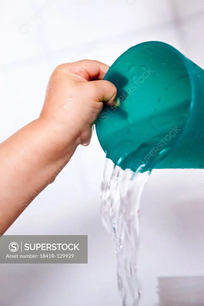 Toddler playing with water