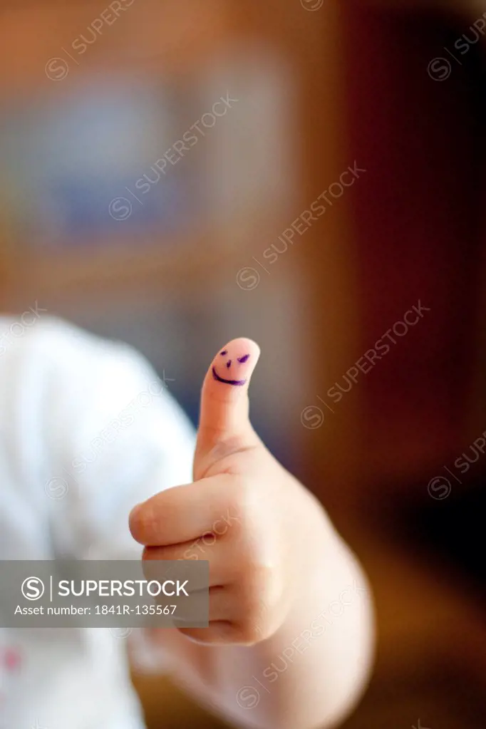 Toddler with thumb up