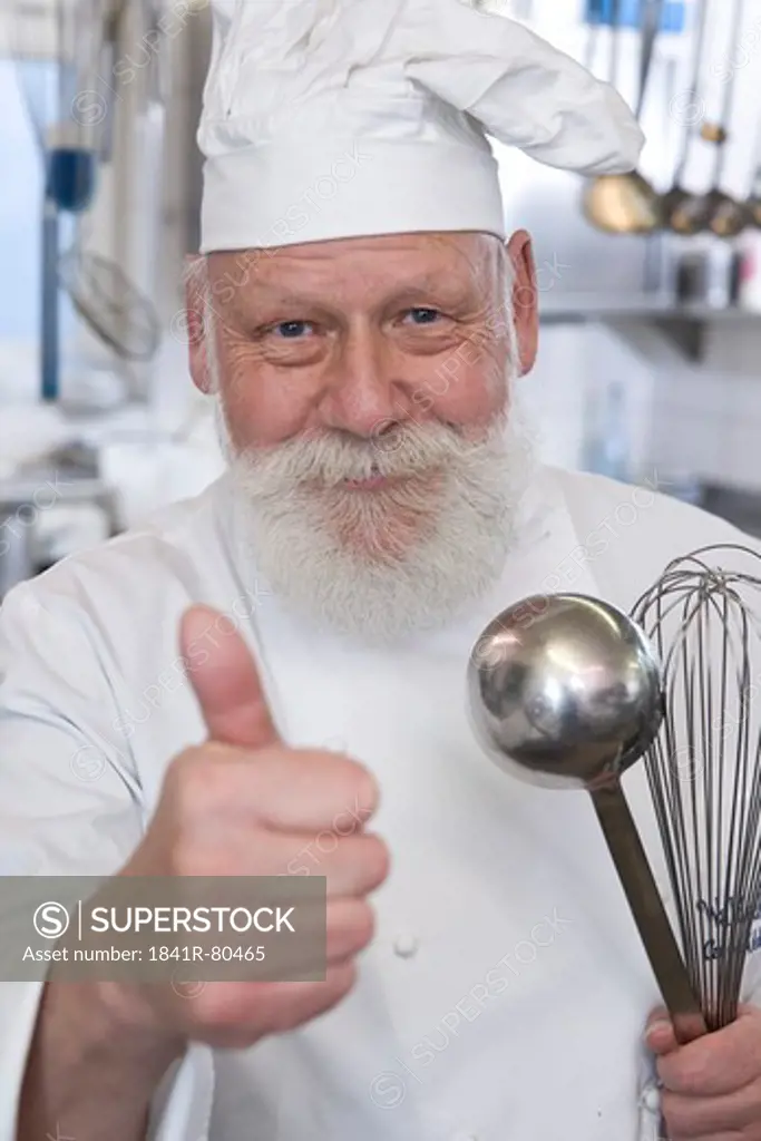 Chef showing thumbs up sign and smiling
