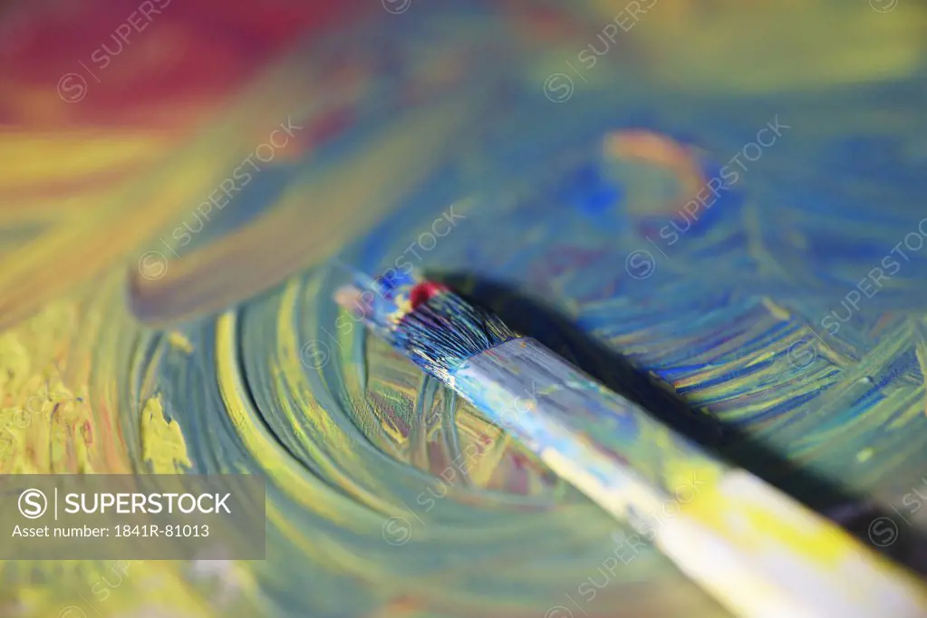 Close-up of paintbrush with paint palette