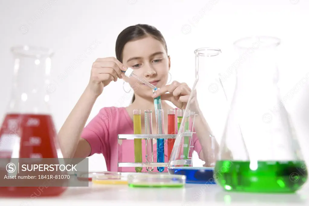 Girl doing experiment in chemistry laboratory