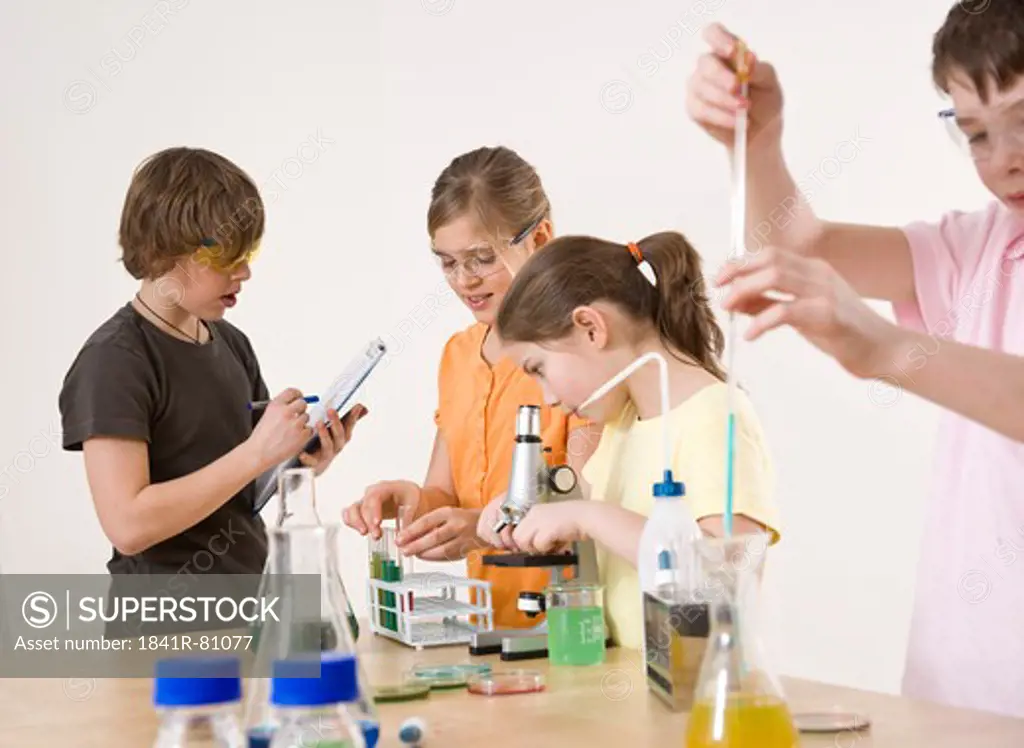 Students doing experiment in chemistry laboratory