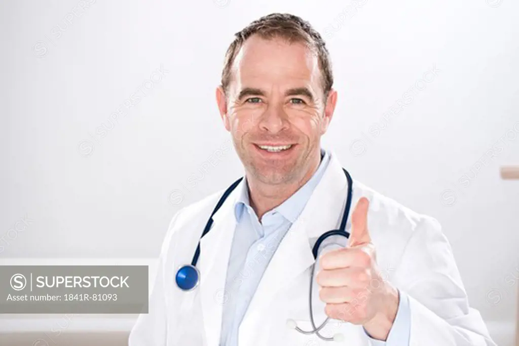 Male doctor showing thumbs up sign