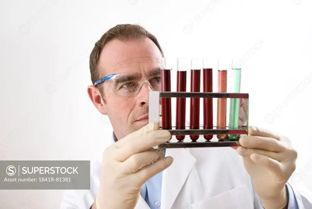 Scientist holding test tube rack
