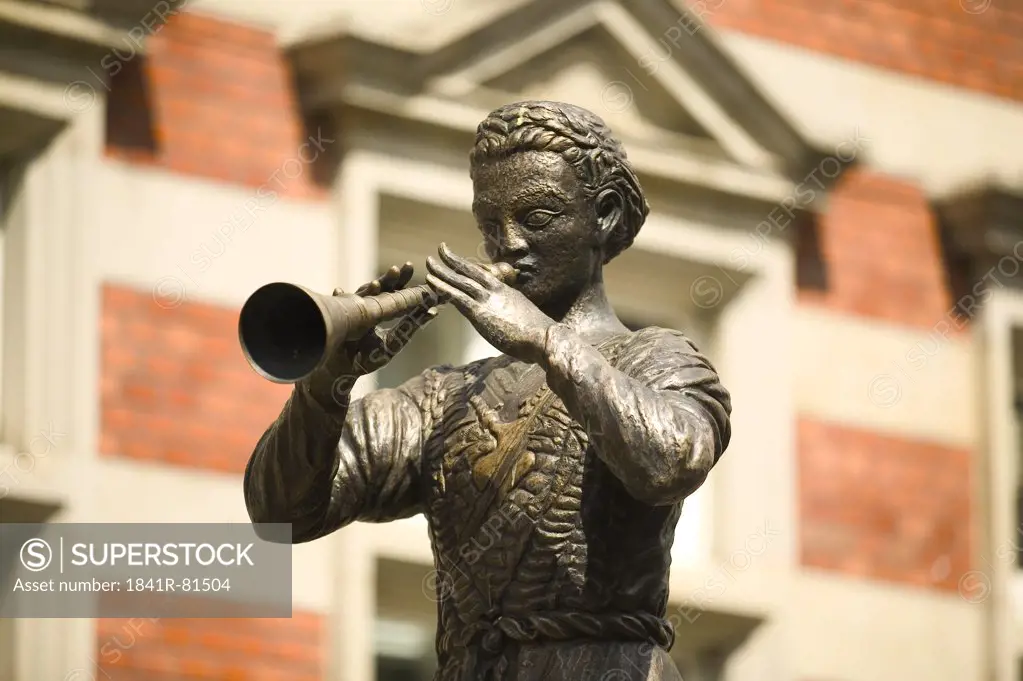 Close-up of statue of man playing trumpet