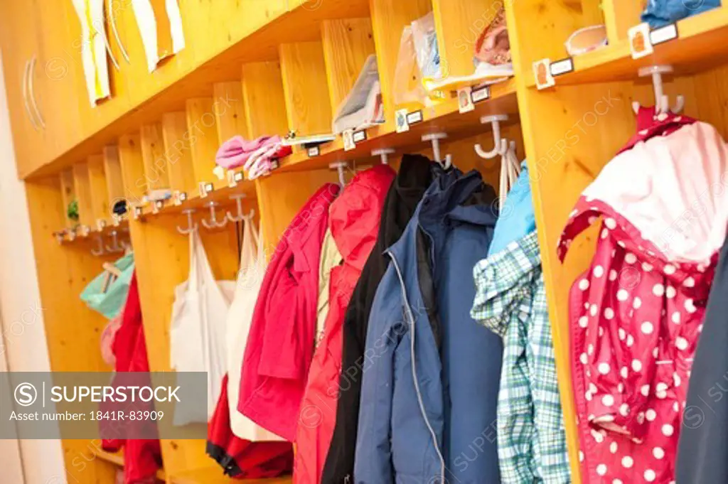 Clothes hanging in the cloakroom of a kindergarten