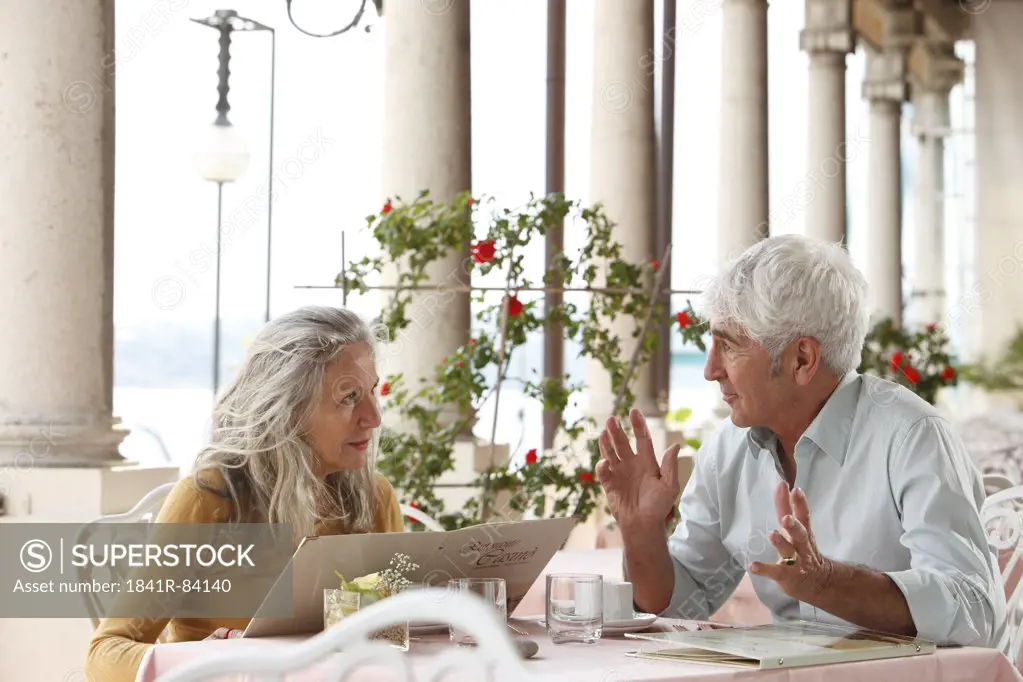 Senior couple in a restaurant, Italy