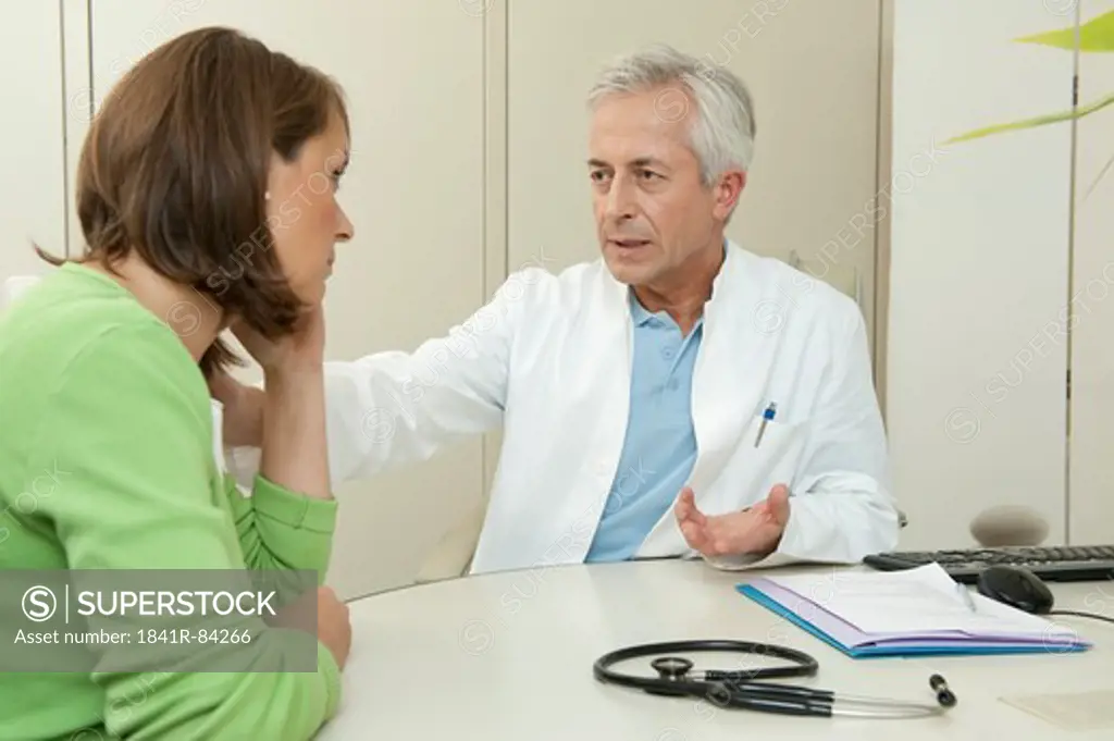 Doctor talking to female patient