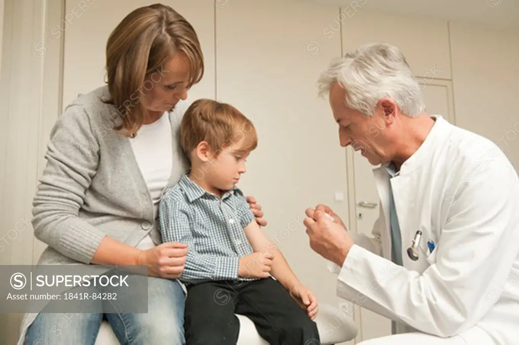 Boy with mother at the doctor
