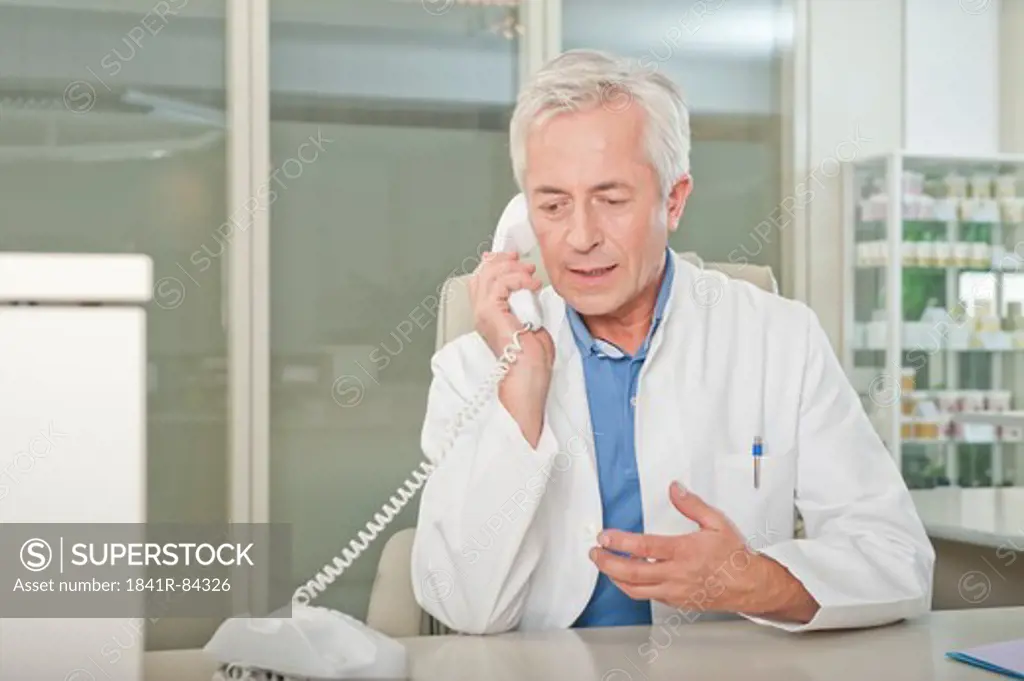 Doctor on the phone at desk
