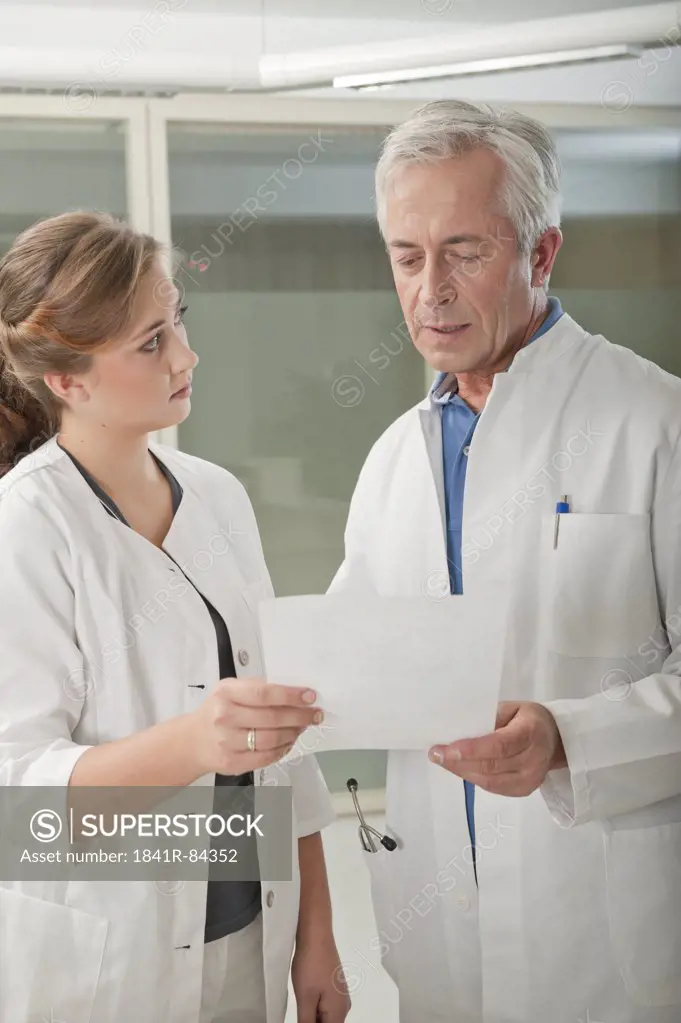 Doctor and doctor's assistant talking