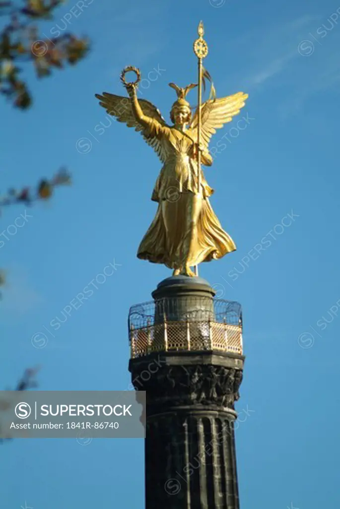Statue of angel on column
