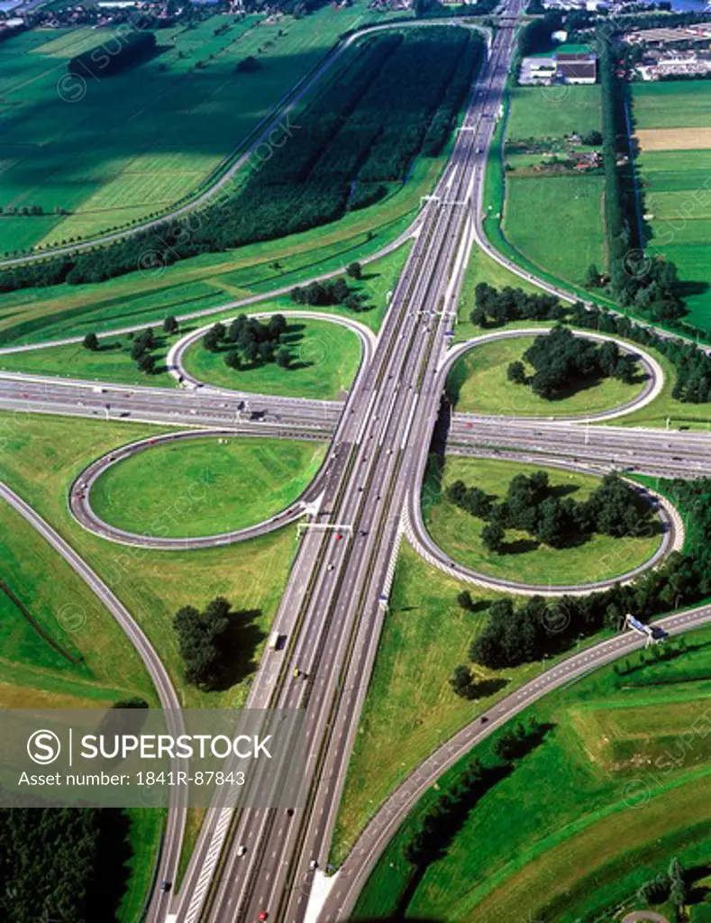 Aerial view of clover leaf-shaped highway overpasses
