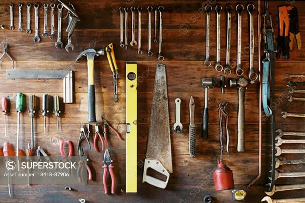 Work tools hanging on wooden board