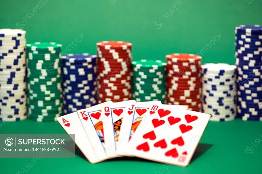 Close-up of gambling chips with cards