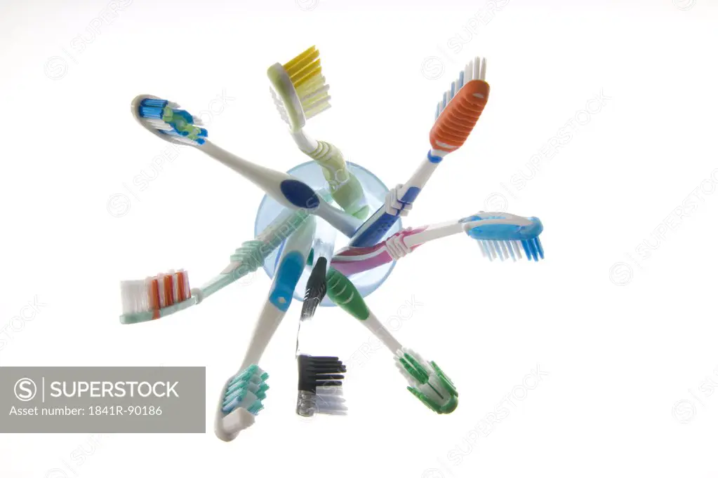 Close-up of toothbrushes in glass