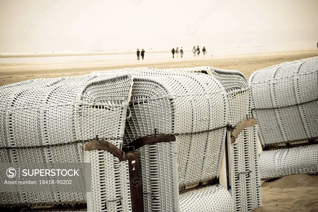 Wicker beach chairs on beach