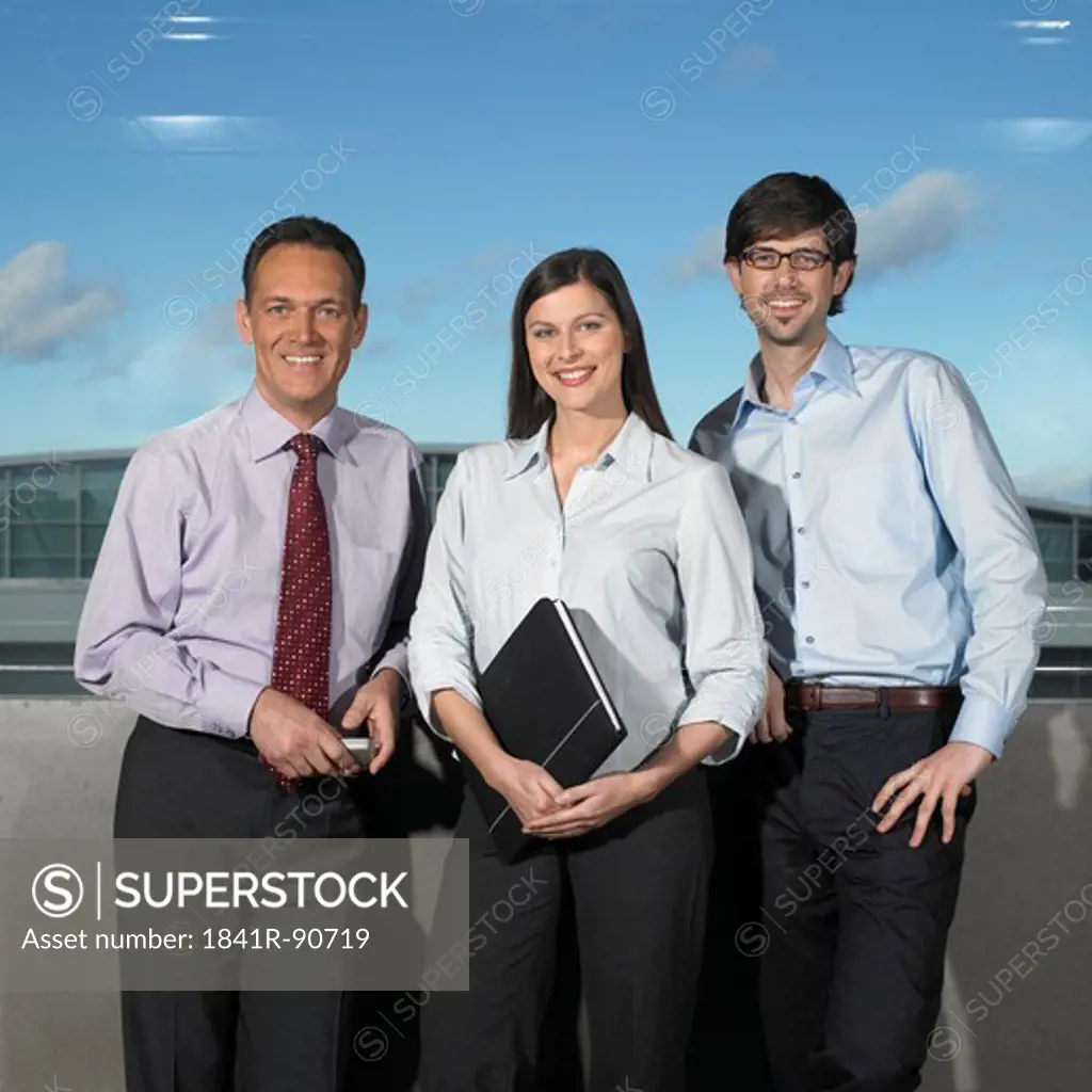 Portrait of three businesspeople smiling