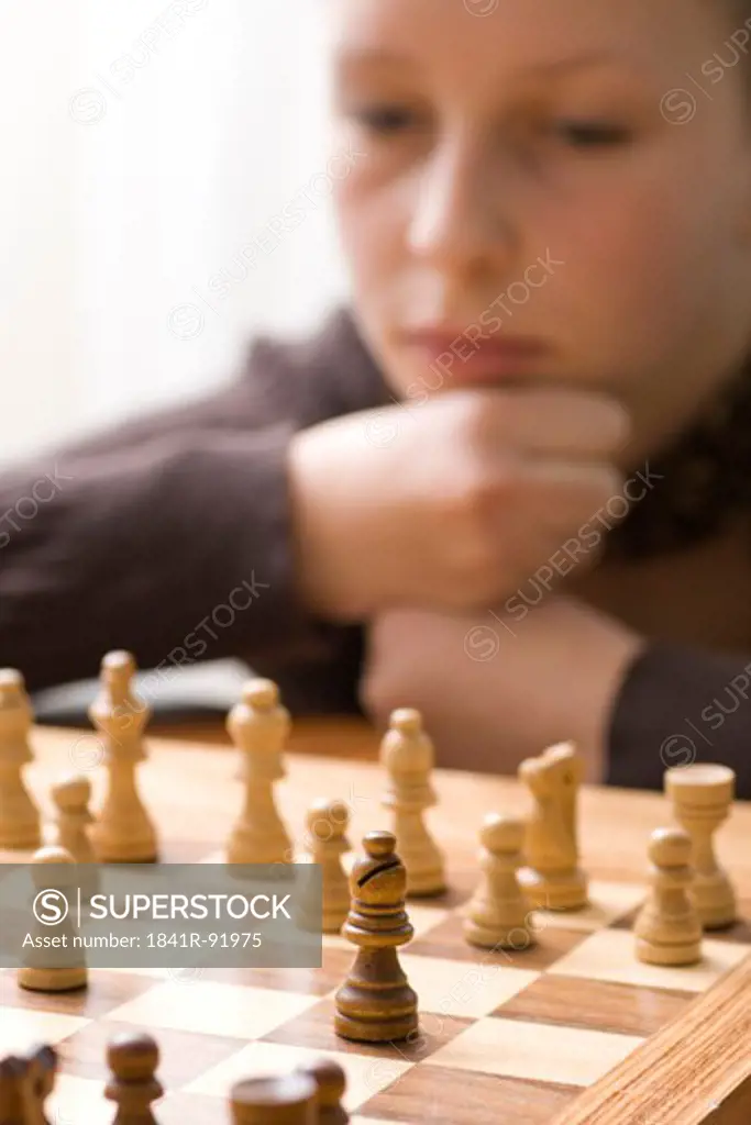 Boy playing chess