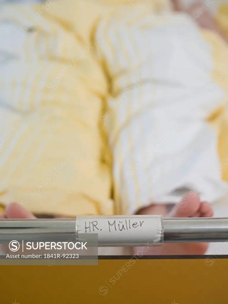 Patient's name label on hospital bed