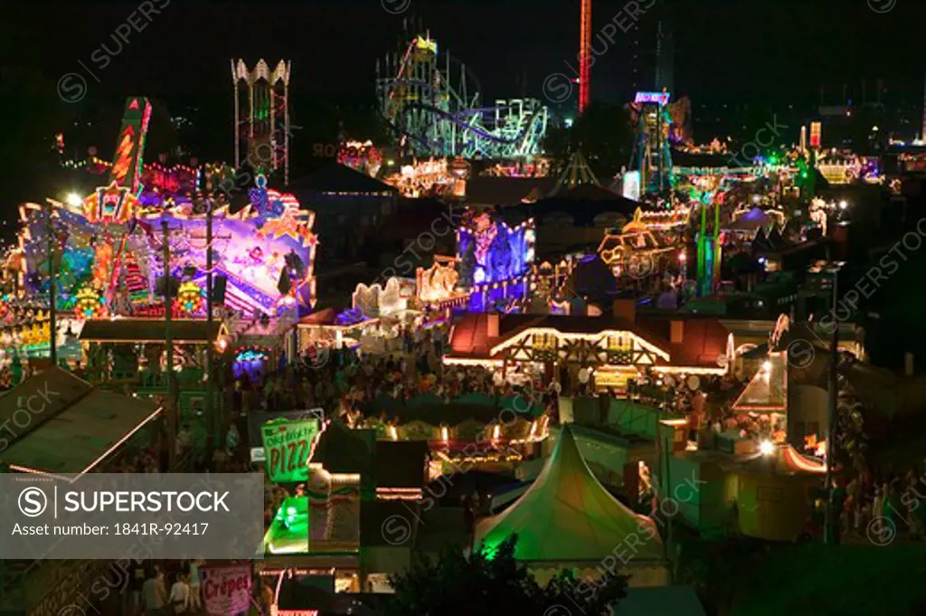 High angle view of people in amusement park at night