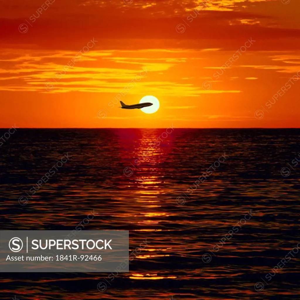 Airplane flying over sea