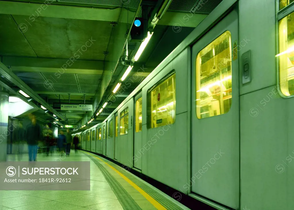 Blurred view of people at railway platform