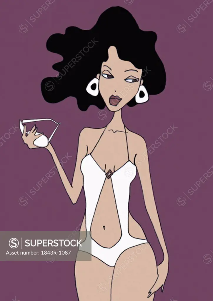 Woman posing in white one-piece bathing suit holding sunglasses