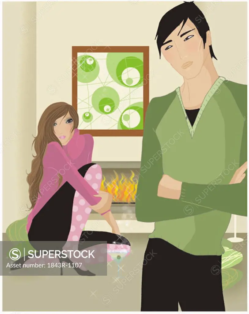 Couple in a living room with the fireplace on