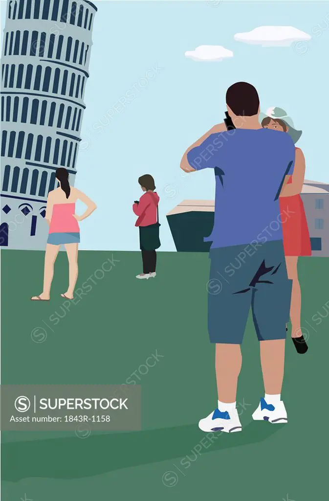 Tourists standing at Leaning Tower of Pisa, Tuscany Italy