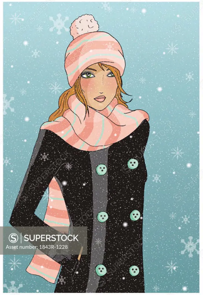 Young woman in snow with hat and scarf