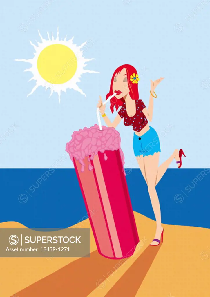 Young woman drinking an enormous granita on the beach