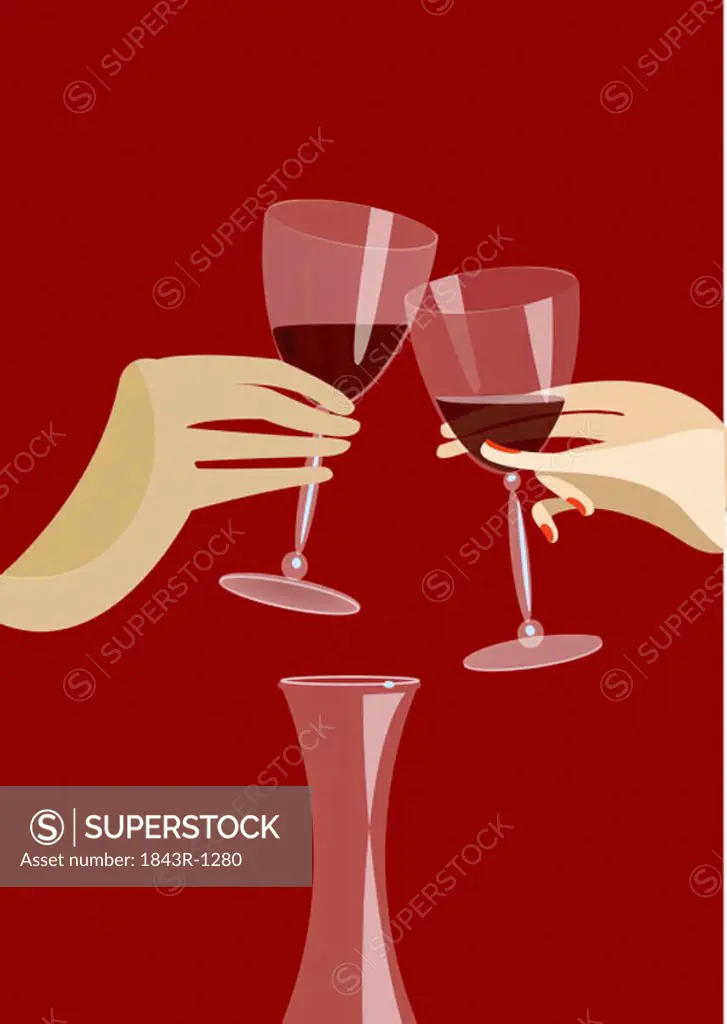 Toasting two glasses of red wine