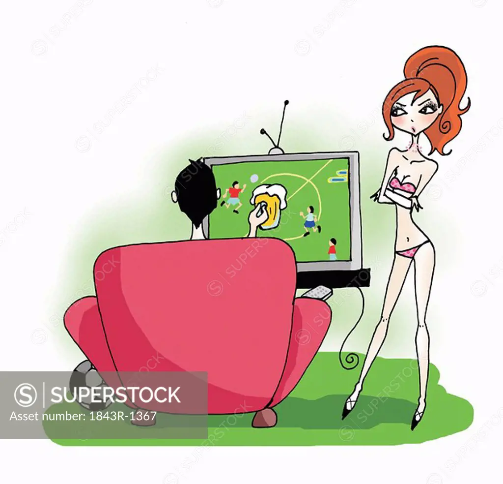 Man watching soccer, woman ignored