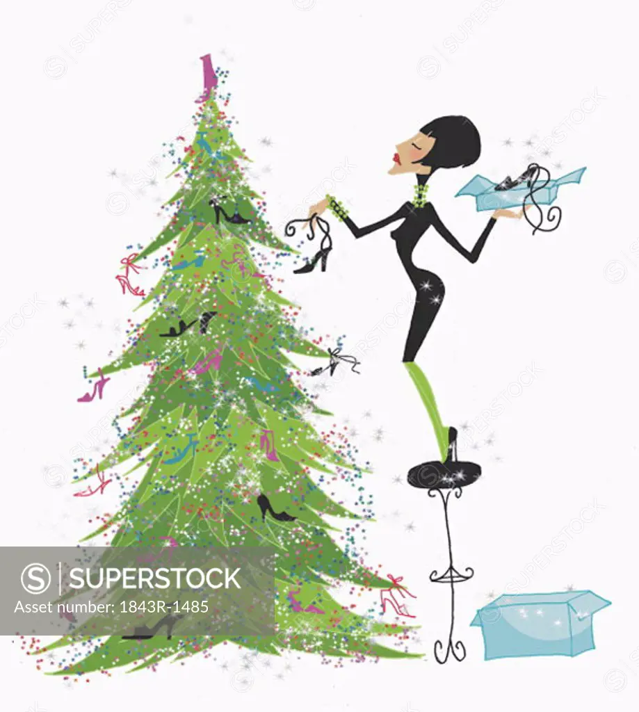 Woman decorating Christmas tree with shoes