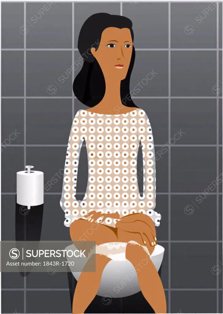 Young woman sitting on toilet