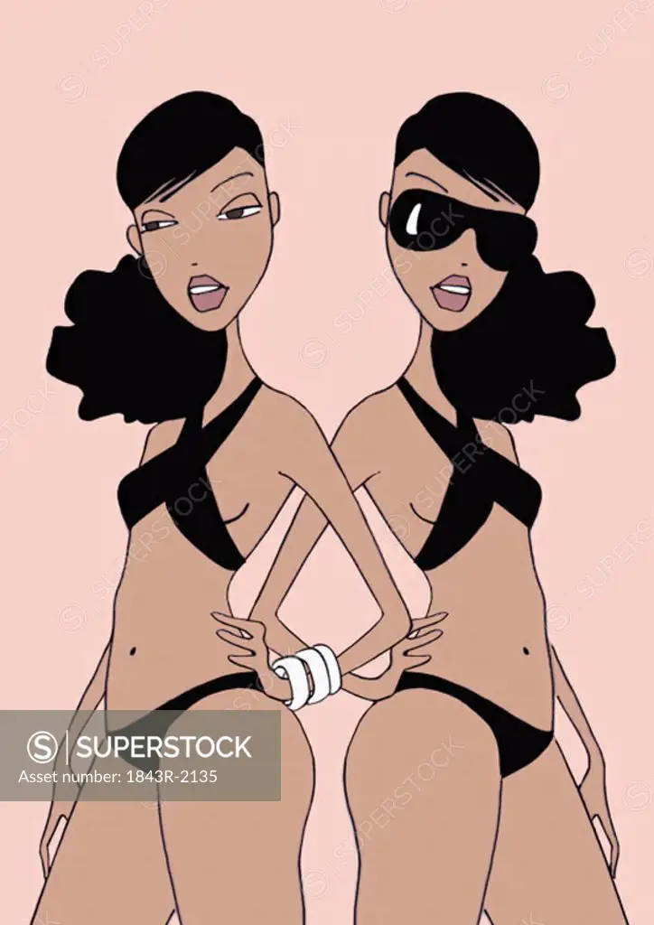 Twin women in black bikinis