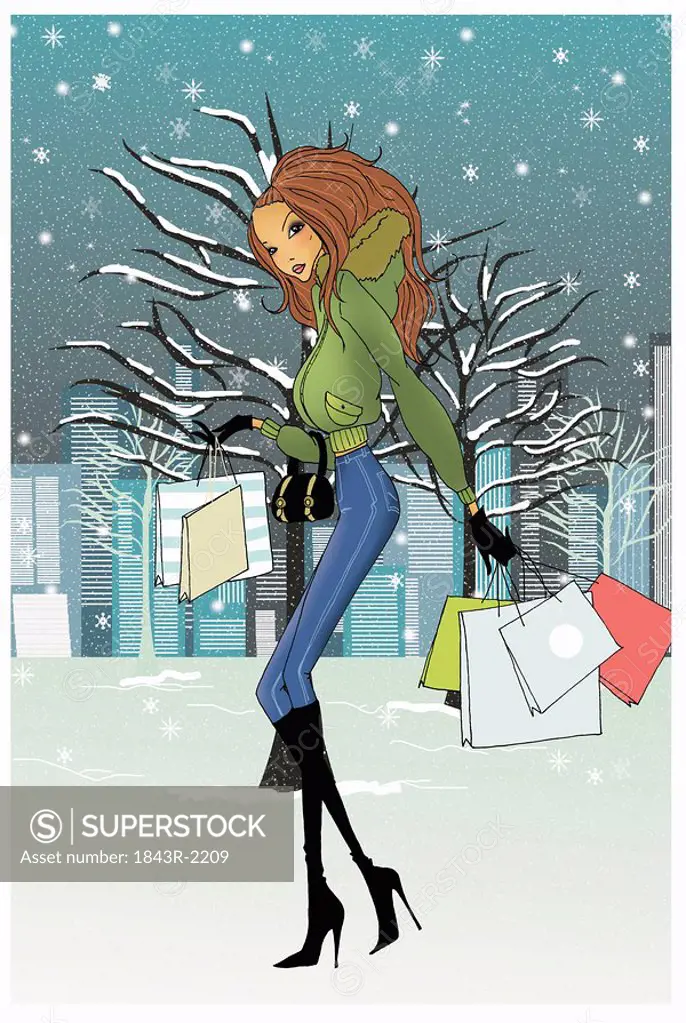 Woman with shopping bags in the snow